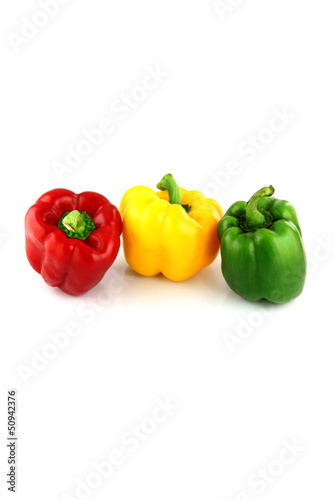 Photo: A Bell peppers Three colors on white Background. A Bell peppers Three colors on white Background.