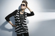 Photo: young woman portrait wearing sunglasses on light background young woman portrait wearing sunglasses on light background