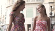 Happy female friends with in the city, super slow motion