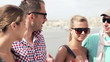 Young friends meeting by the river, super slow motion