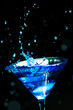 blue splashing cocktail on black