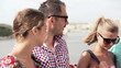 Young friends meeting by the city river