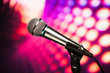 Photo: microphone against purple disco background microphone against purple disco background