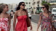 Happy female friends in the city, super slow motion