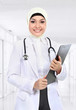moslem asian doctor writing on paperclip