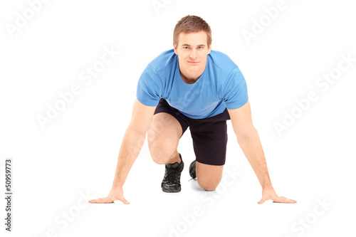 Photo: A male athlete ready to run A male athlete ready to run