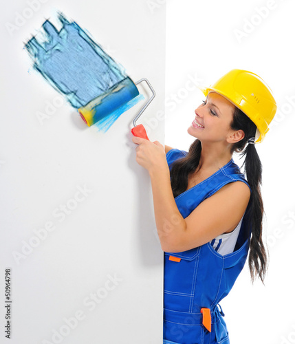Photo: Beautiful young woman doing repairs Beautiful young woman doing repairs