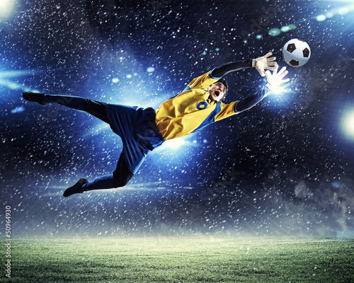 Photo: Goalkeeper catches the ball Goalkeeper catches the ball