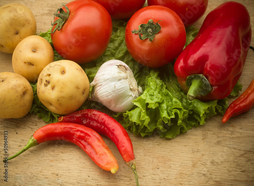Photo: Healthy fresh vegetables ingredients for cooking in rustic setti Healthy fresh vegetables ingredients for cooking in rustic setti