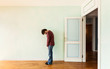 portrait of a weird guy in a room with the door open