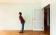 portrait of a weird guy in a room with the door open