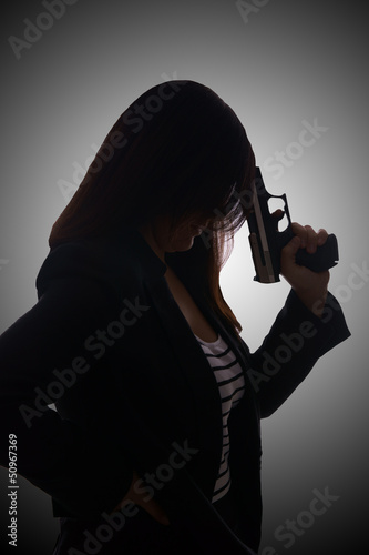 Photo: woman with handgun woman with handgun