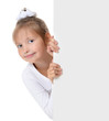 Photo: Little girl peeking from behind the advert Little girl peeking from behind the advert