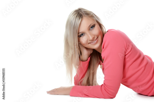 Photo: The beautiful young woman smiles isolated on white background The beautiful young woman smiles isolated on white background
