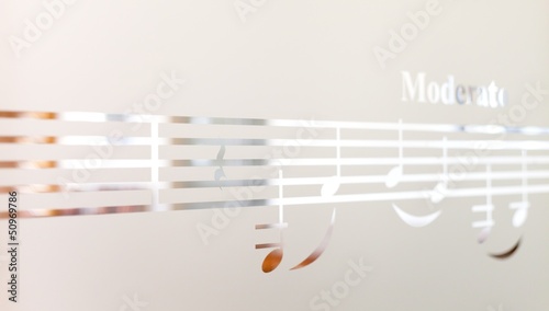 Photo: Musical notes on frosted glass, art background Musical notes on frosted glass, art background