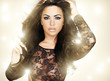 beautiful dark haired girl in sexy lingerie golden glowing light