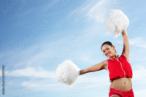 Photo: Young female cheerleader Young female cheerleader