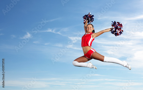 Photo: Young female cheerleader Young female cheerleader