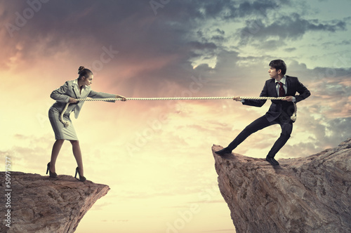 Photo: People pull the rope. People pull the rope.