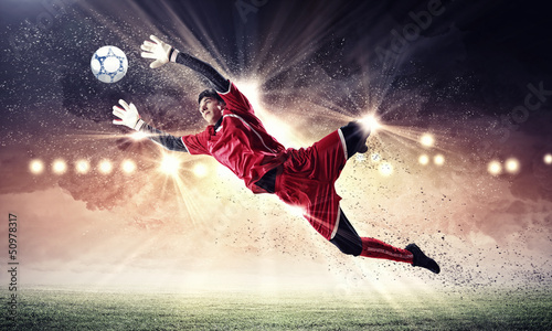 Photo: Goalkeeper catches the ball Goalkeeper catches the ball