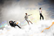 Three business people pulling rope