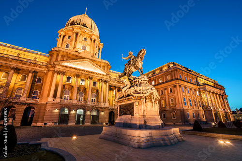 Photo: Illuminated main facade of the Buda Castle in Budapest at ni Illuminated main facade of the Buda Castle in Budapest at ni