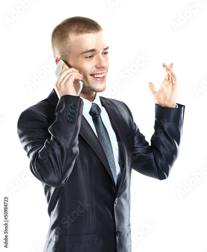 Photo: Portrait of handsome young business man using cell phone Portrait of handsome young business man using cell phone