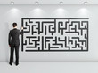 man drawing maze