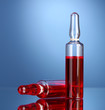 medical ampules on blue background