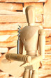 Mannequin with corkscrew, on brown wall background