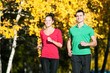 Photo: Young man and woman running Young man and woman running