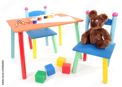 Photo: Small and colorful table and chairs for little kids isolated Small and colorful table and chairs for little kids isolated