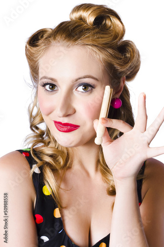 Photo: Happy woman with clothes peg Happy woman with clothes peg