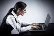 Business woman working with laptop.