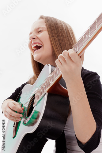 Photo: Beautiful girl with guitar on white background Beautiful girl with guitar on white background