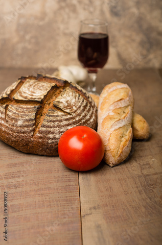Photo: Loaf of fresh rye bread on a table Loaf of fresh rye bread on a table