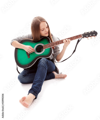 Photo: Beautiful girl with guitar on white background Beautiful girl with guitar on white background
