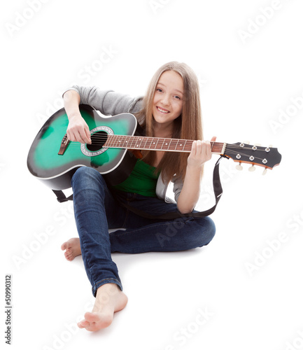 Photo: Beautiful girl with guitar on white background Beautiful girl with guitar on white background