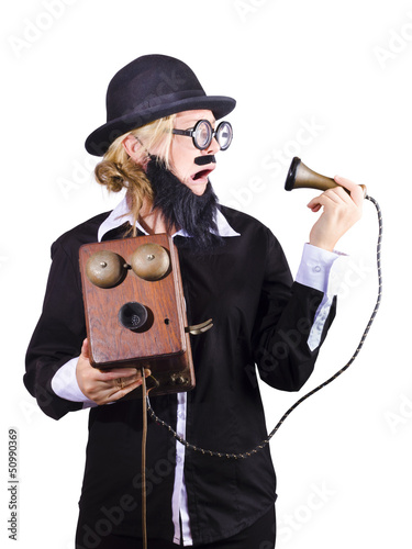Photo: Woman holding antique telephone Woman holding antique telephone