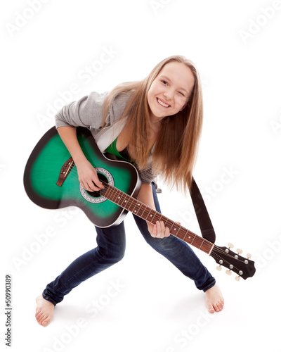 Photo: .Beautiful girl with guitar on white background .Beautiful girl with guitar on white background