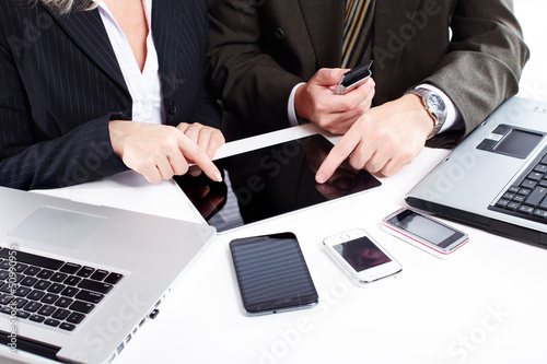 Photo: Business people group working with laptop. Business people group working with laptop.