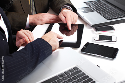 Photo: Business people group working with laptop. Business people group working with laptop.