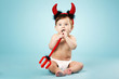 little funny baby with devil horns and trident