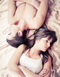 Foto: Upset couple sleeping separately on their bed Upset couple sleeping separately on their bed