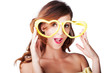Funny woman with heart shape sunglasses
