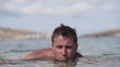 Happy man relaxing in sea, super slow motion, shot at 240fps