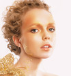 Golden Woman's Face. Curly Hair. Professional Bronzed Makeup