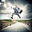 Businessman running on the road