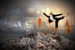 businesswoman standing atop of mountain