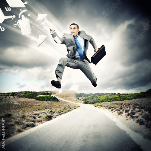Photo: Businessman running on the road Businessman running on the road